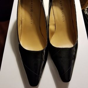 Black leather pumps